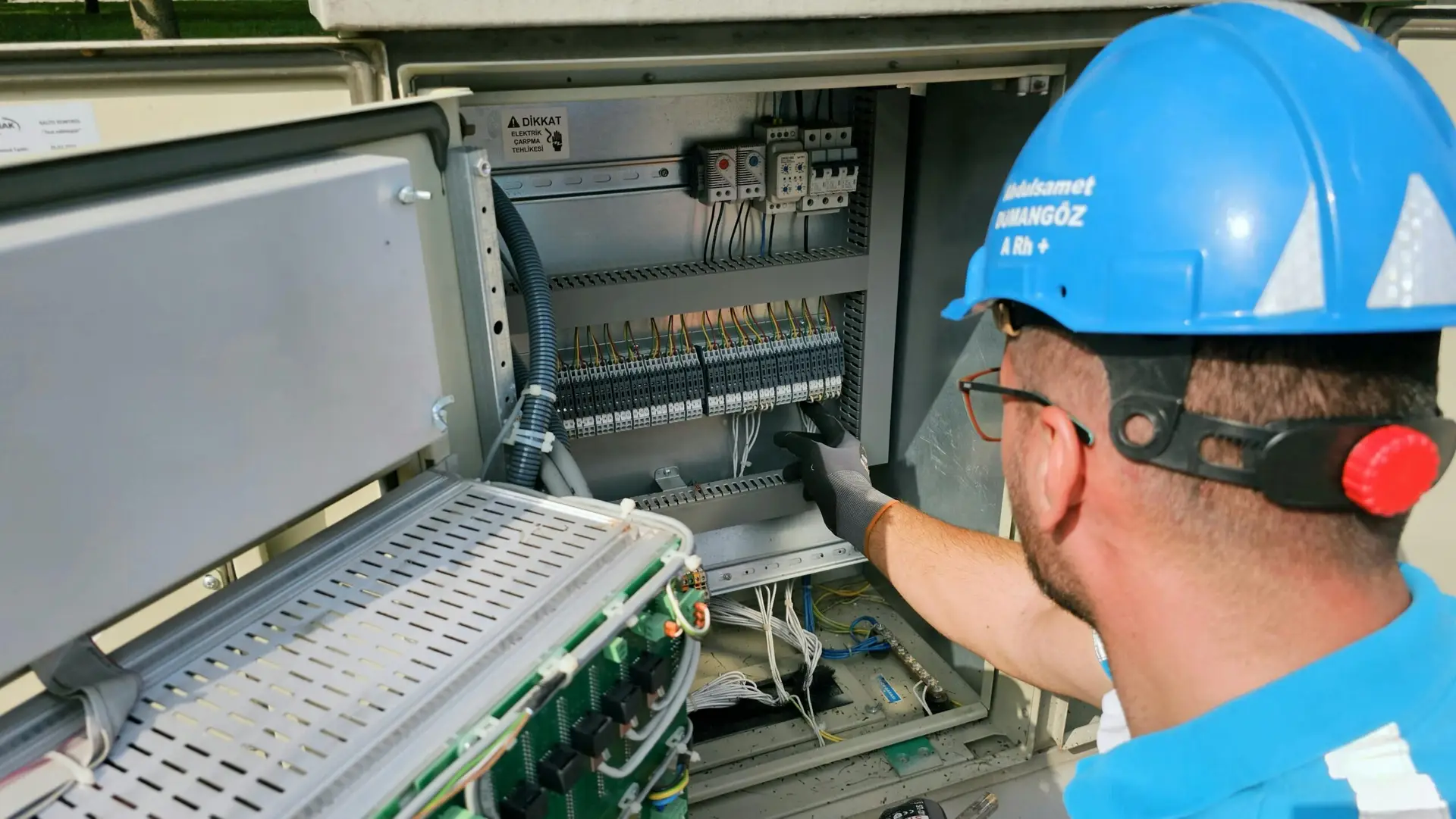 Network cable installer performing a system maintenance check