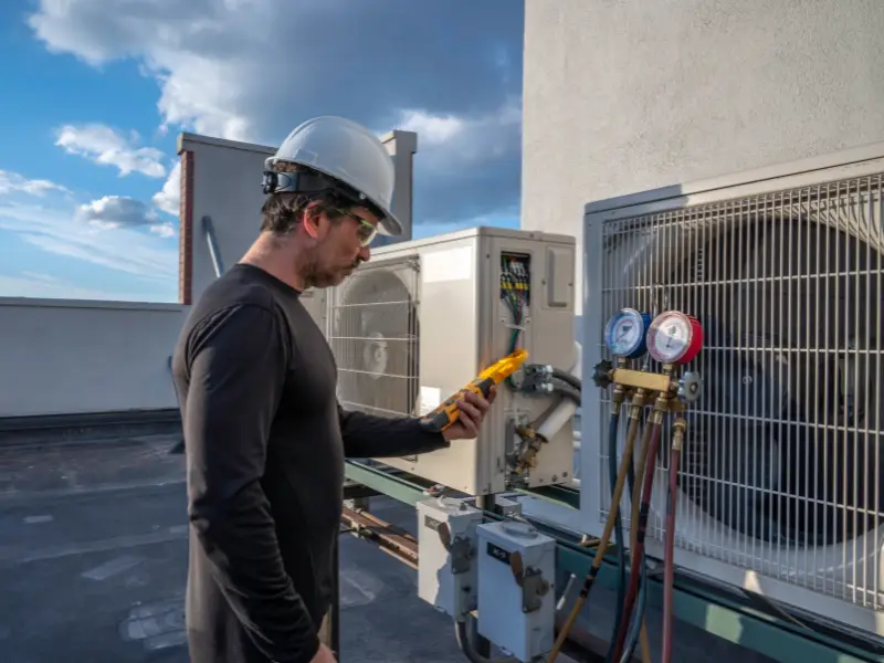 HVAC Technician working on a commerical roof top system.