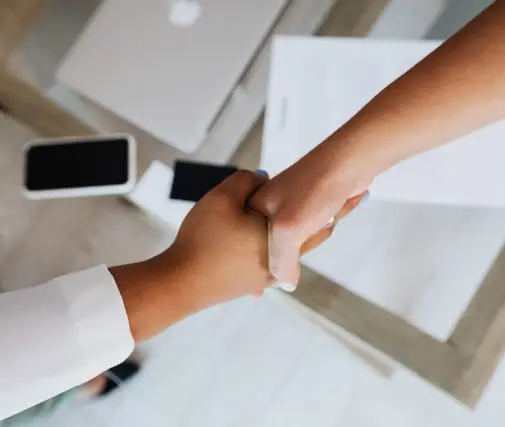 Two people shaking hands.