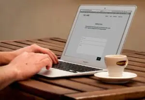 Image of a person completing a contact form on their laptop