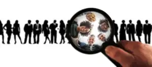 Image of people standing in a row with a magnifying glass focused onfive specific people.