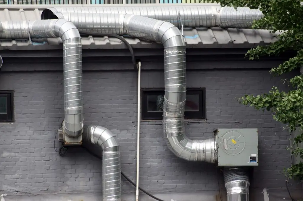 HVAC exterior units and external vent piping image.