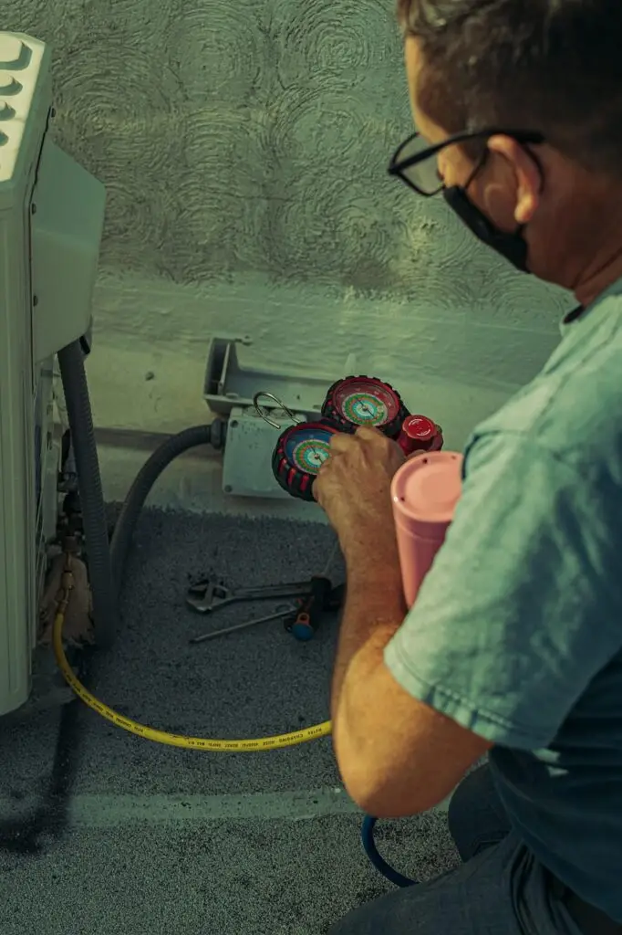 HVAC Technician calibrating a rooftop unit.